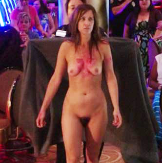 Where we can see her bush and naked tits as she walks through the casino wi...